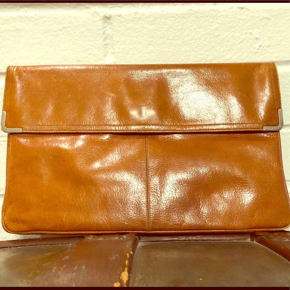 French-made burnt orange clutch